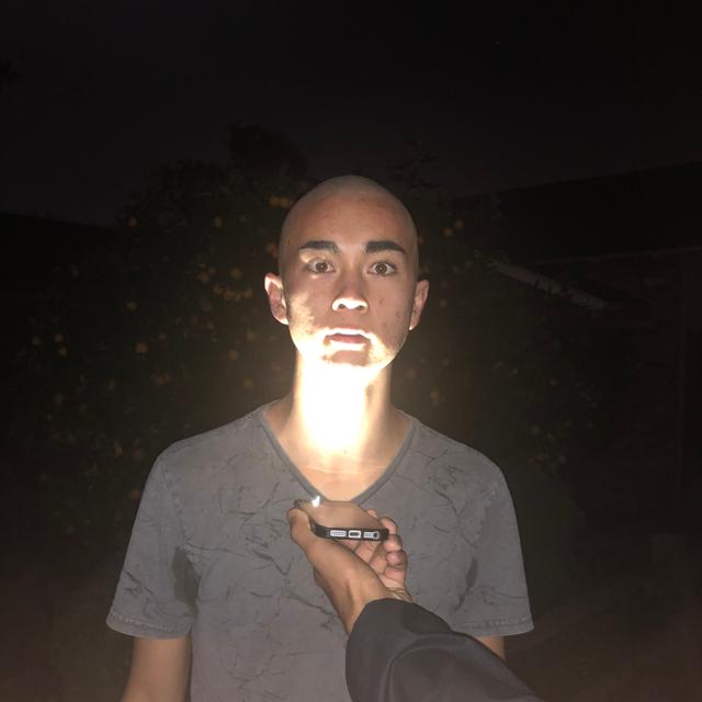 bald stephen staring scarily while a flashlight is pointed at his face from underneath