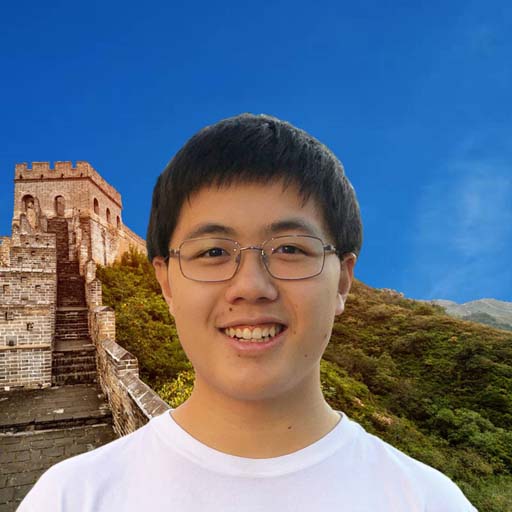 Dylon standing in front of the Great Wall of China