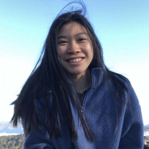 Hannah smiling on top of a hill